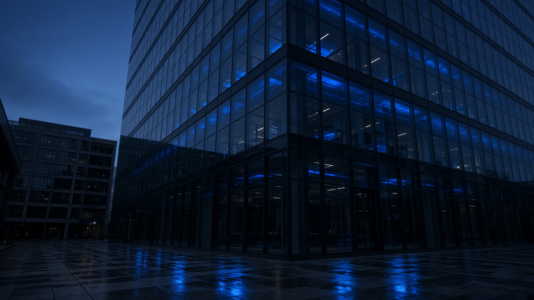 Hexagonal network etched into dark metal, catching a blue highlight.